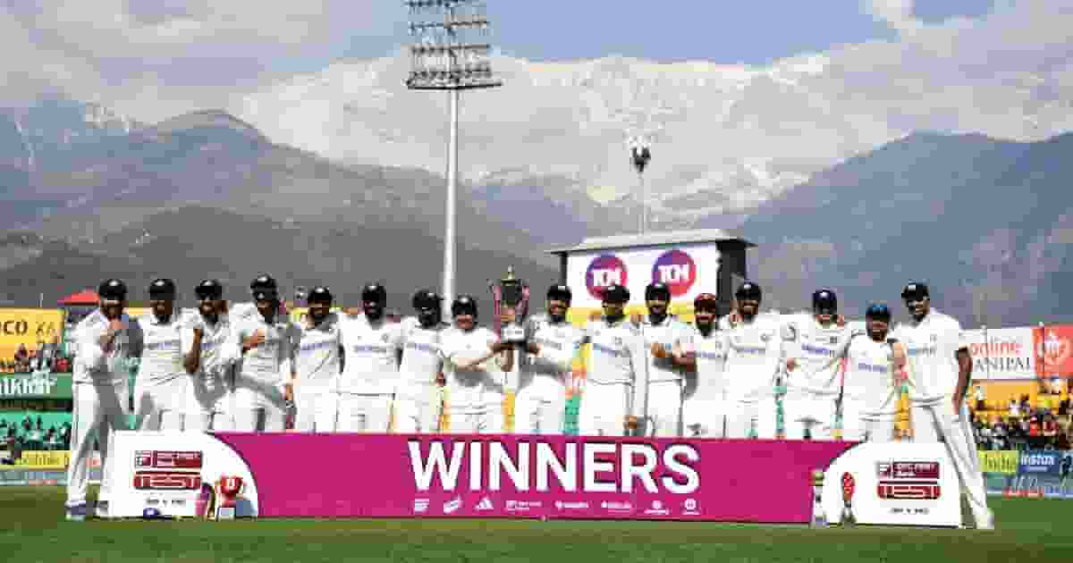 indian team standing with trophy at dharamshala stadium